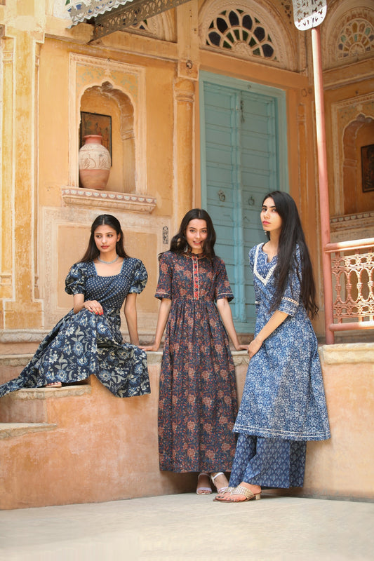 a group of three women standing next to each other