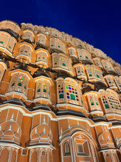 a very tall building with many windows on top of it