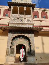 A man standing in front of a tall building