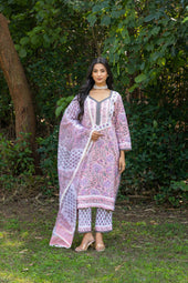 Woman wears a traditional floral indian outfit.