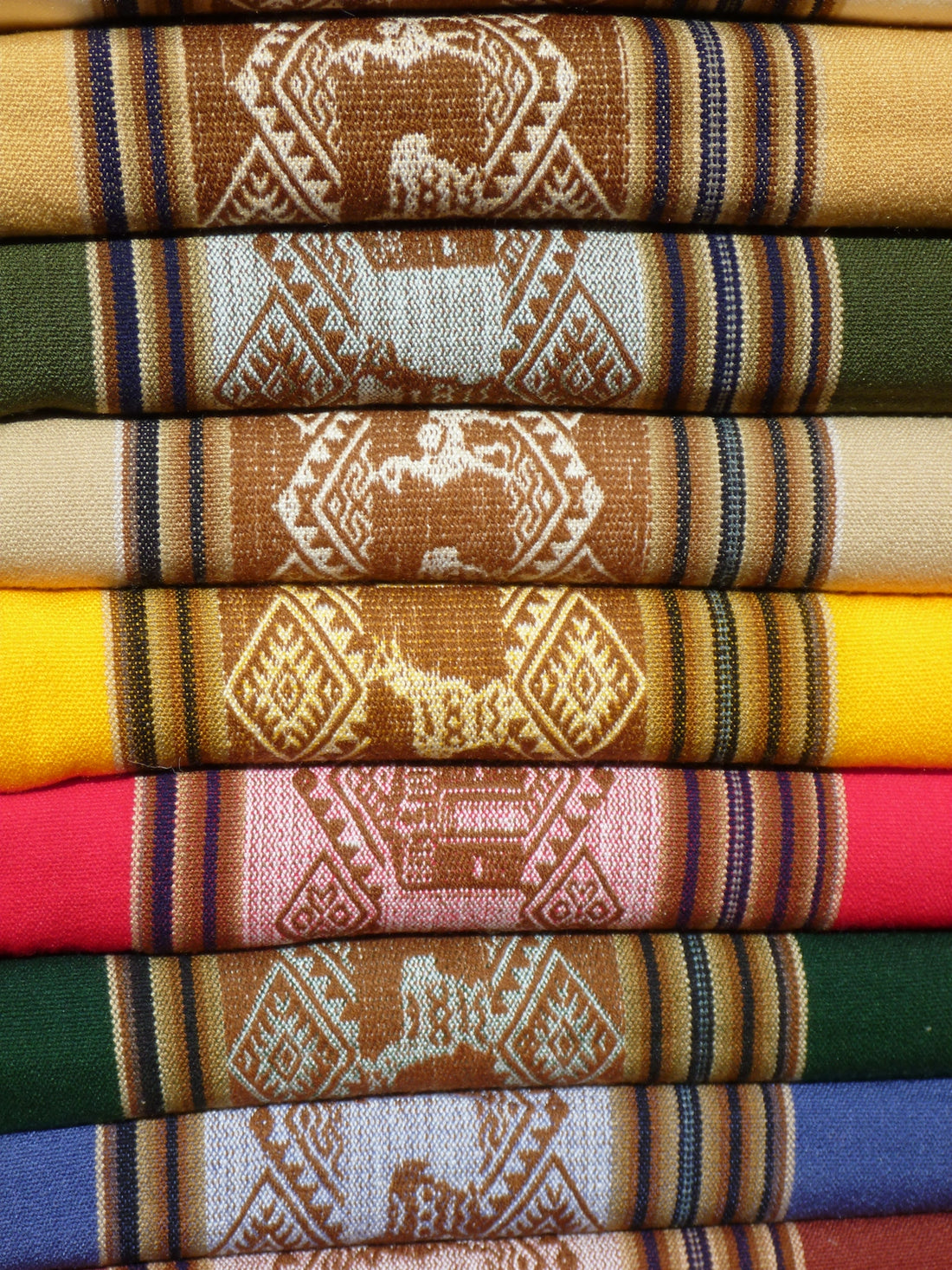 red green and brown textile