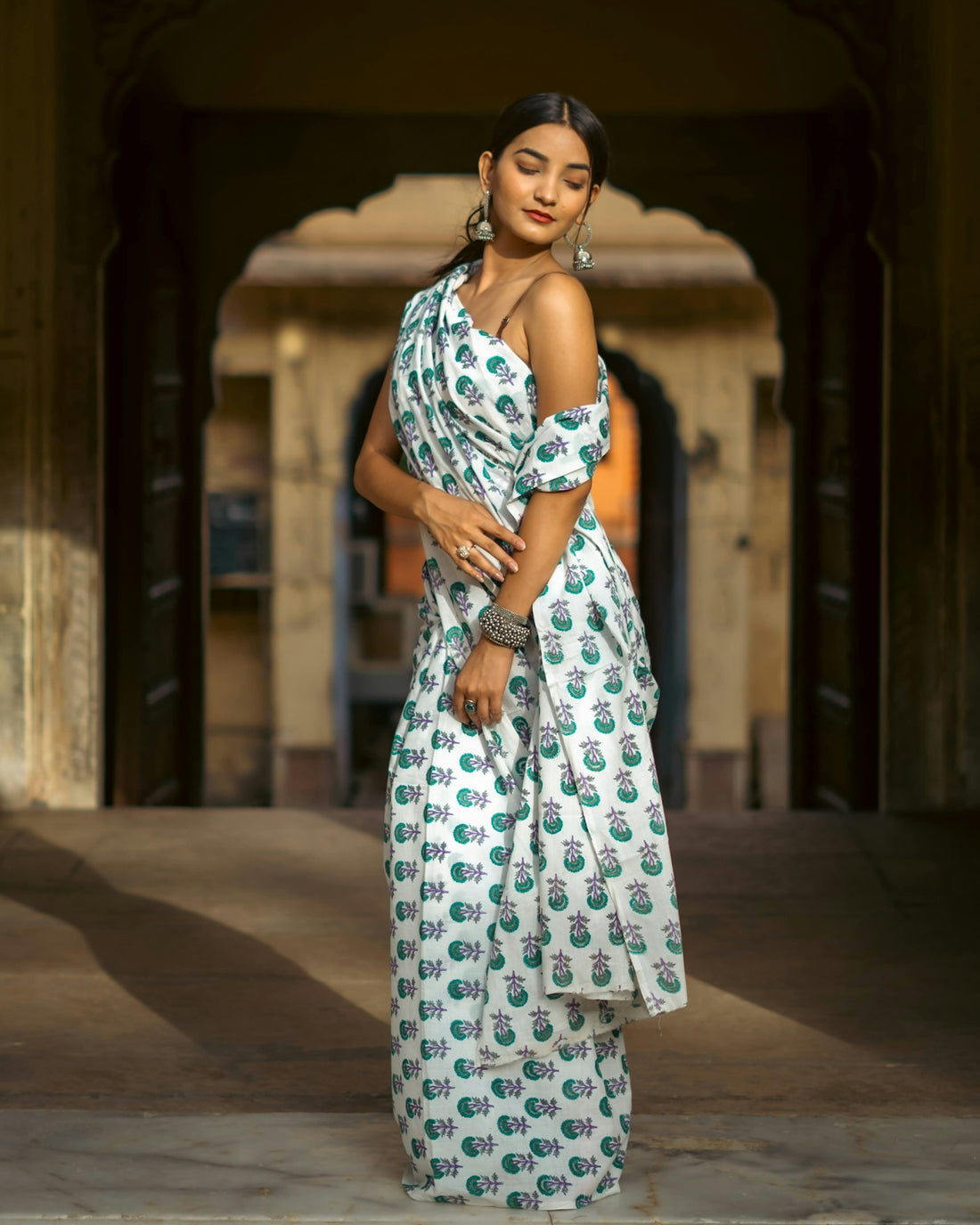 a woman in a white and green dress