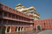 a large red building with City Palace, Jaipur in the background