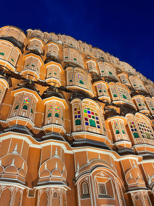 a very tall building with many windows on top of it