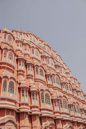 a very tall building with many windows and balconies