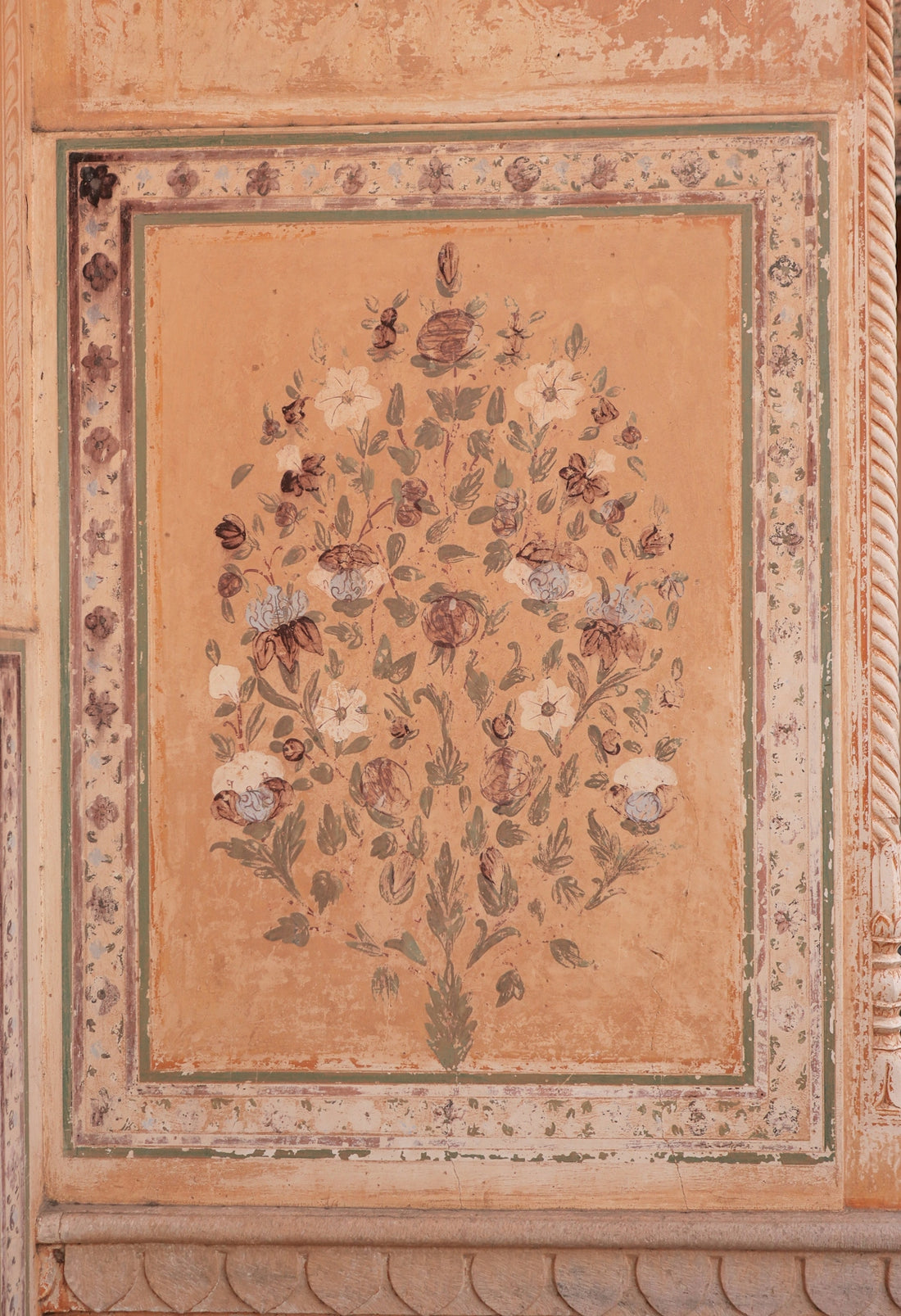 A painting of a tree on a wall