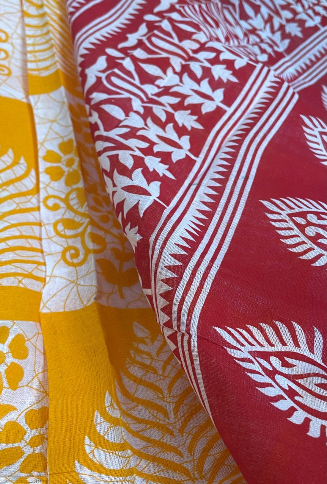 A close up of a red and yellow fabric