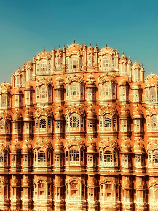 Here is a short caption: hawa mahal in jaipur, india, stands majestic.