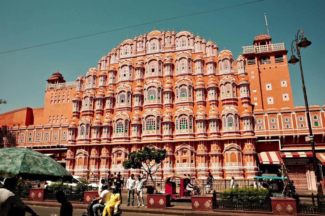Ornate pink palace facade with many windows