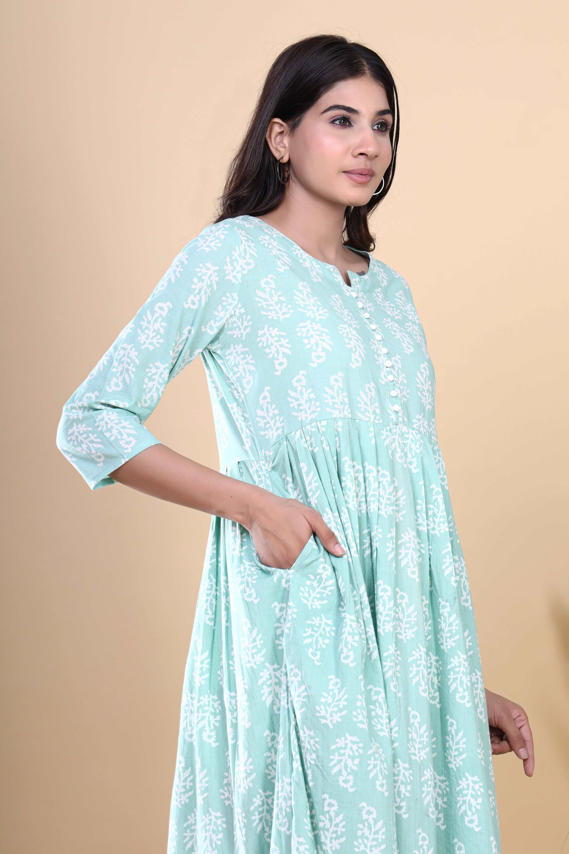 Jaipuri Blossoms: Handblock Printed Cotton Long Kurti in Bluish Cyan with Floral Artistry and Pocket Accent