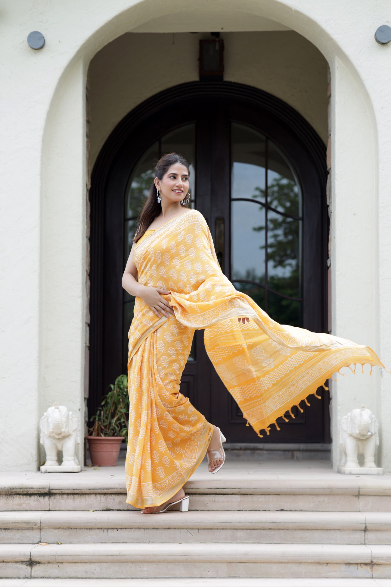 Sunset Blossom: Sanganeri Block Dabu Floral Saree in Yellowish Orange